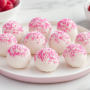 White chocolate raspberry cheesecake balls